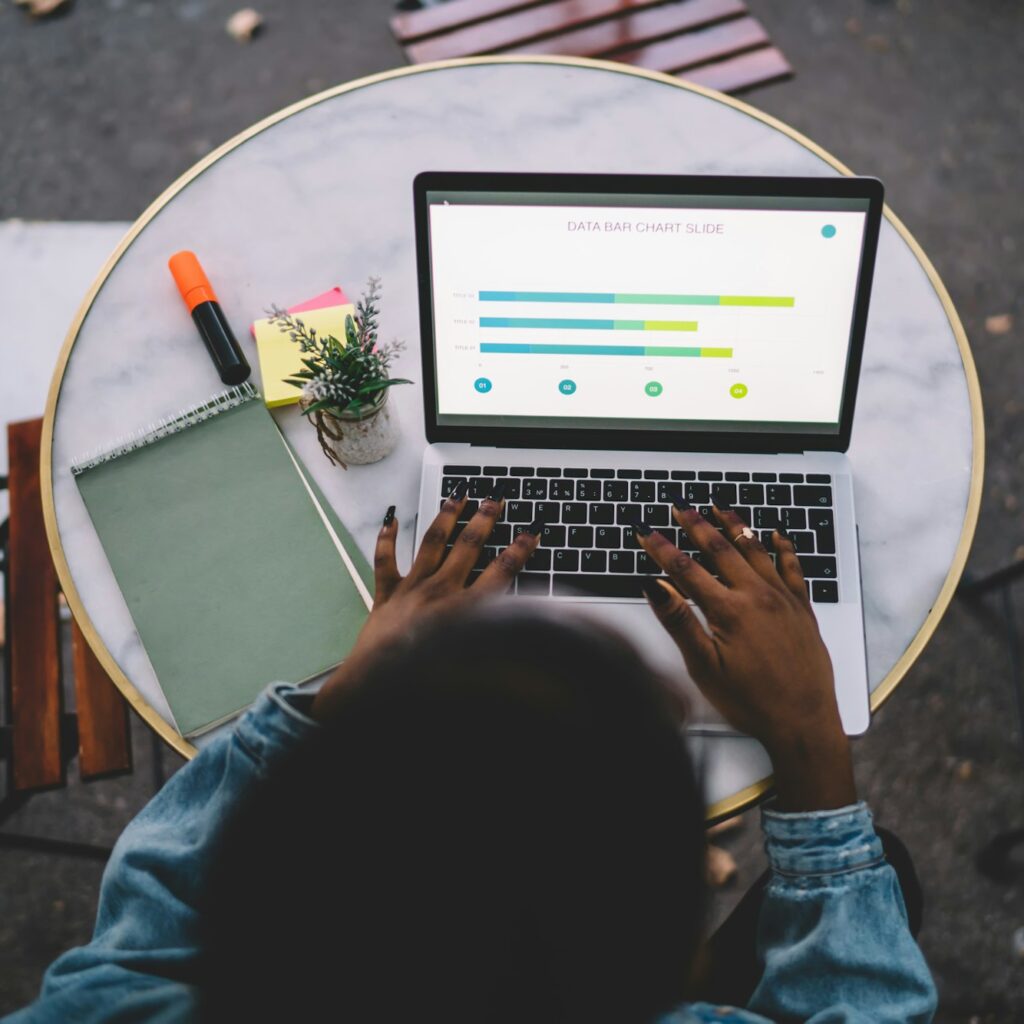 Top view of female student e learning trade accounting during online courses on laptop computer